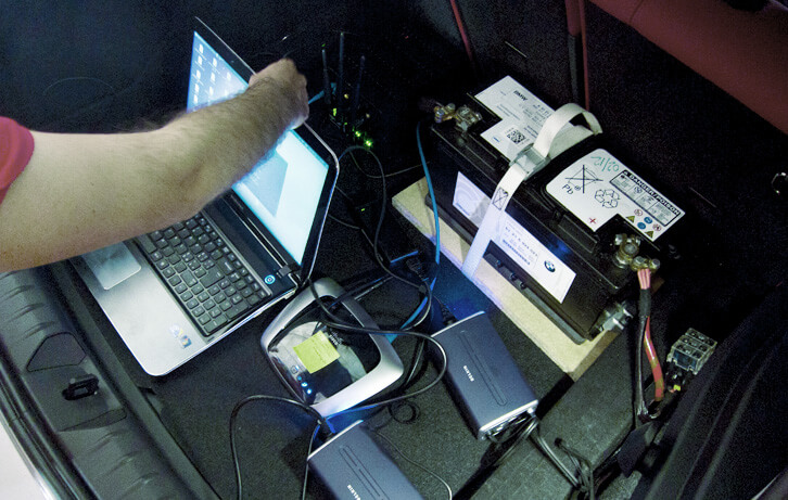 The trunk of the car, showing the server, the power suppliers and the router